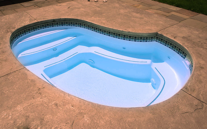 Alaglas Pools' Cove model, small fiberglass pool in white