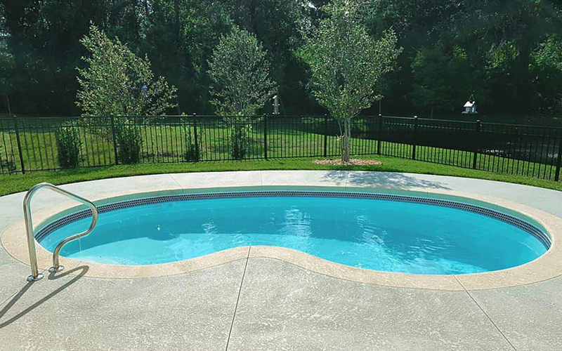 Alaglas Pools' June Bug model, a medium, freeform fiberglass pool in quartz